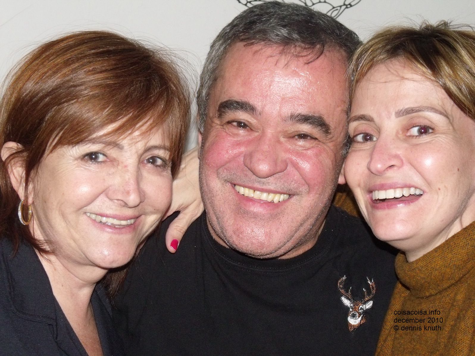 Lisette, Helton and Concinha hug for friendship