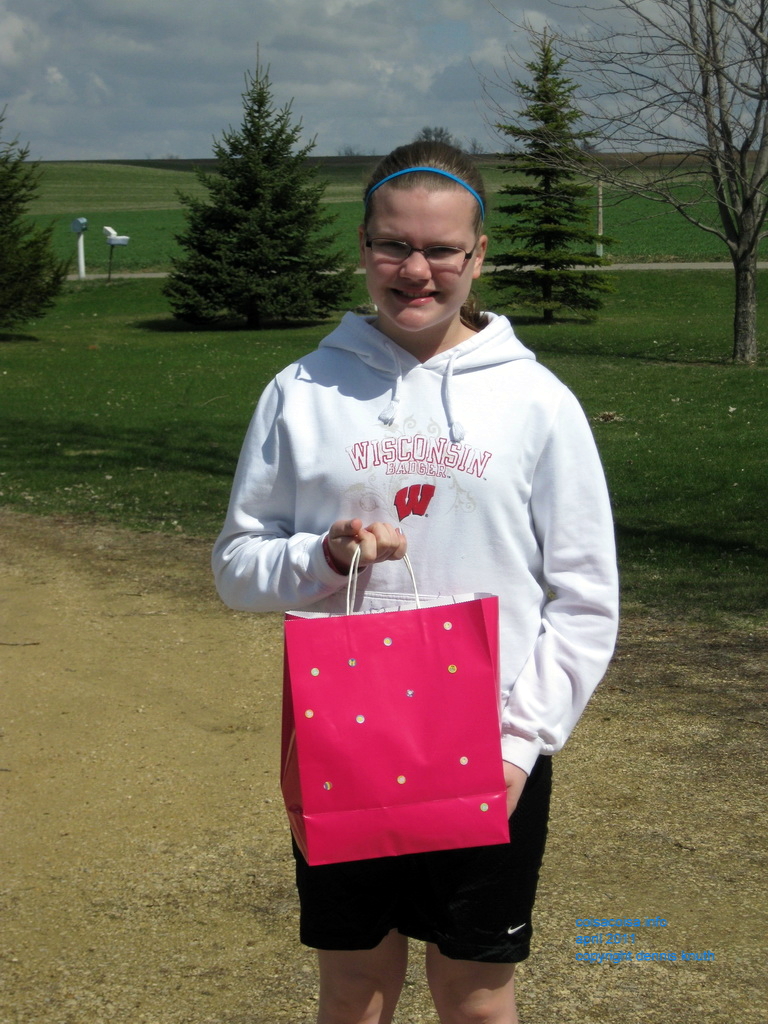Kelsey shows of her Easter Egg Hunt treasures