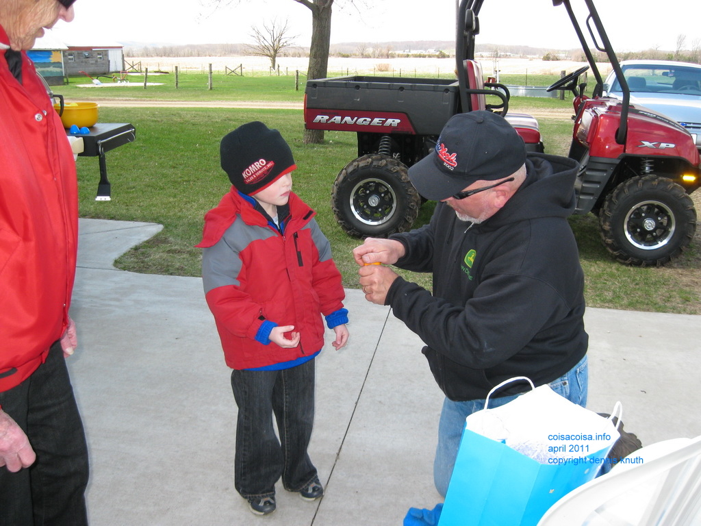 Grandpa Gary helps Jared open a surprise egg