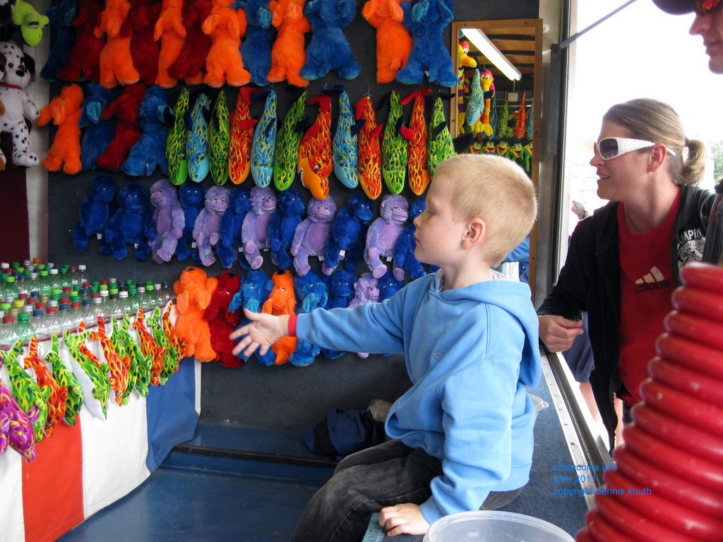 Jared makes a carnival toss to win