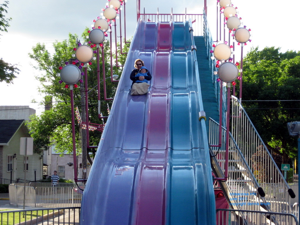 Grandmother Sherri on a slide with Jared