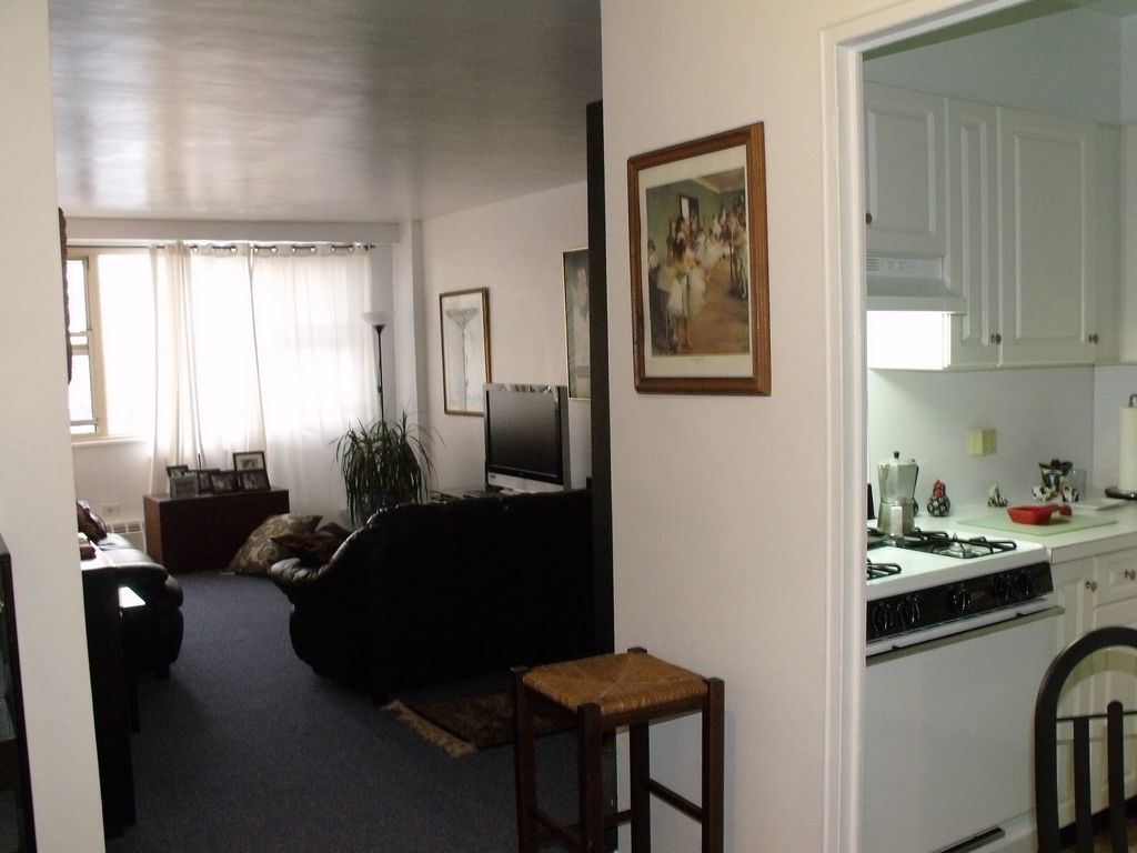 Elmhurst Towers is a good place to live (large) Living Room from the dinning area