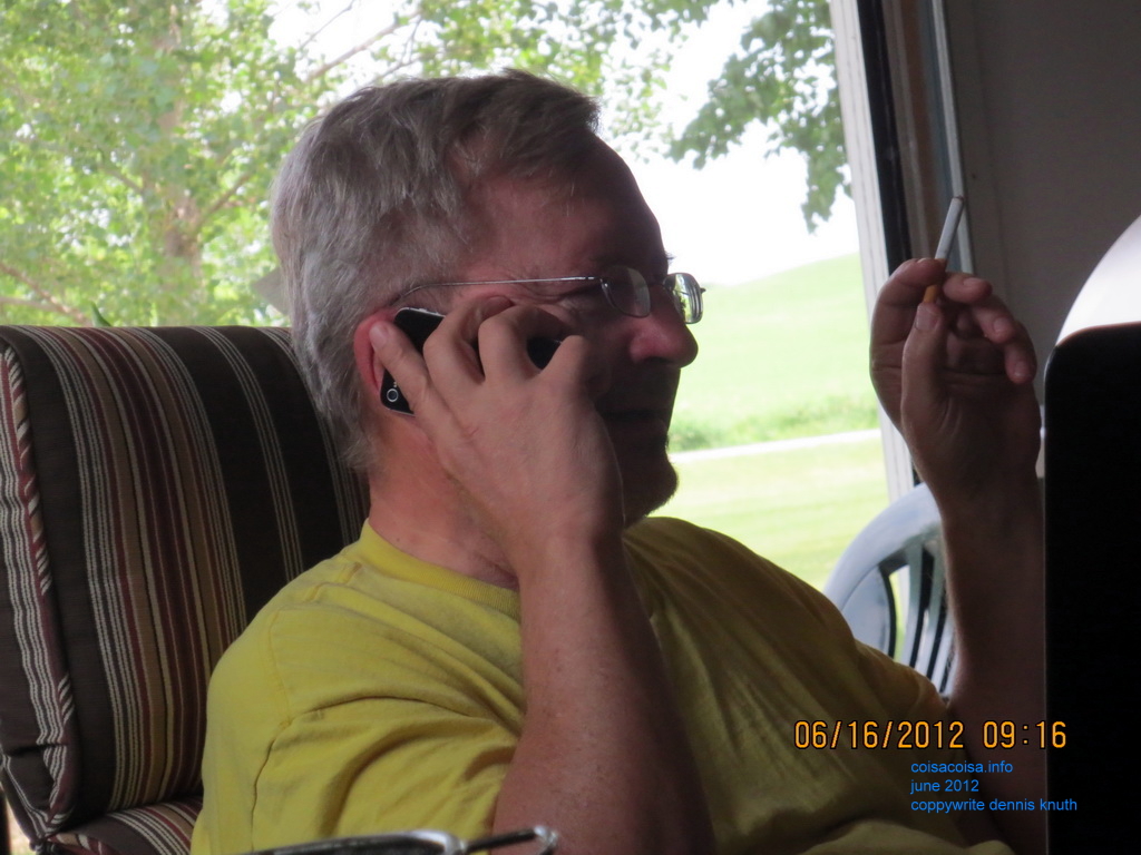 Gloria photographs Dennis after the funeral