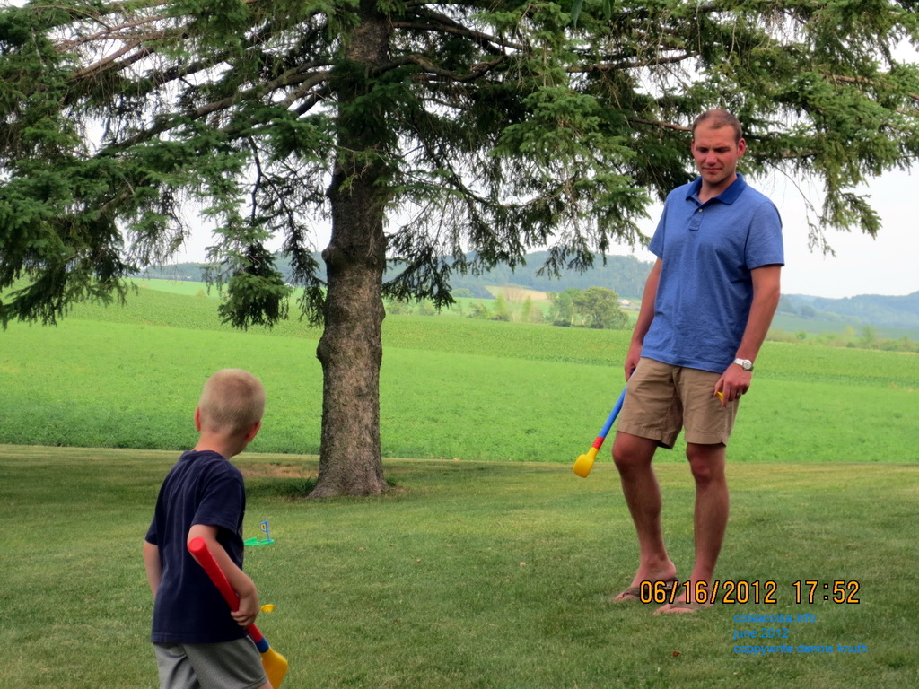Justin and Jared golf in the driveway
