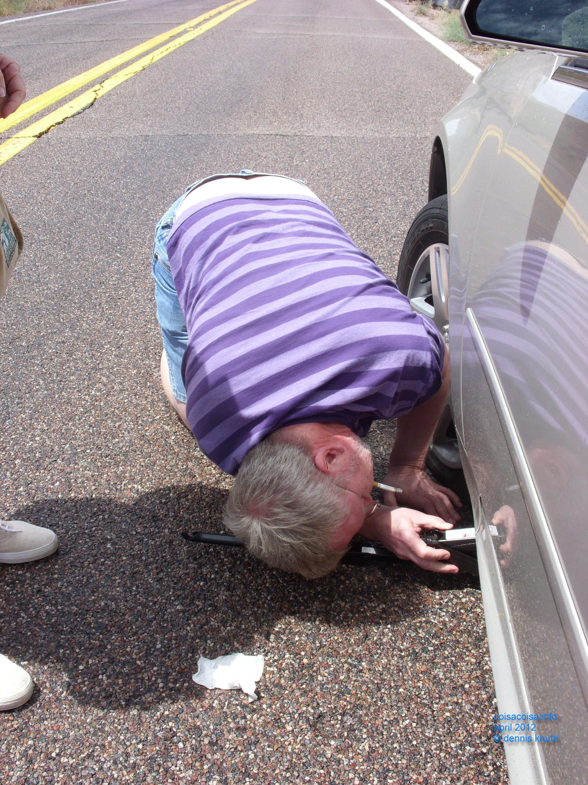 Dennis placing the car jack on the frame
