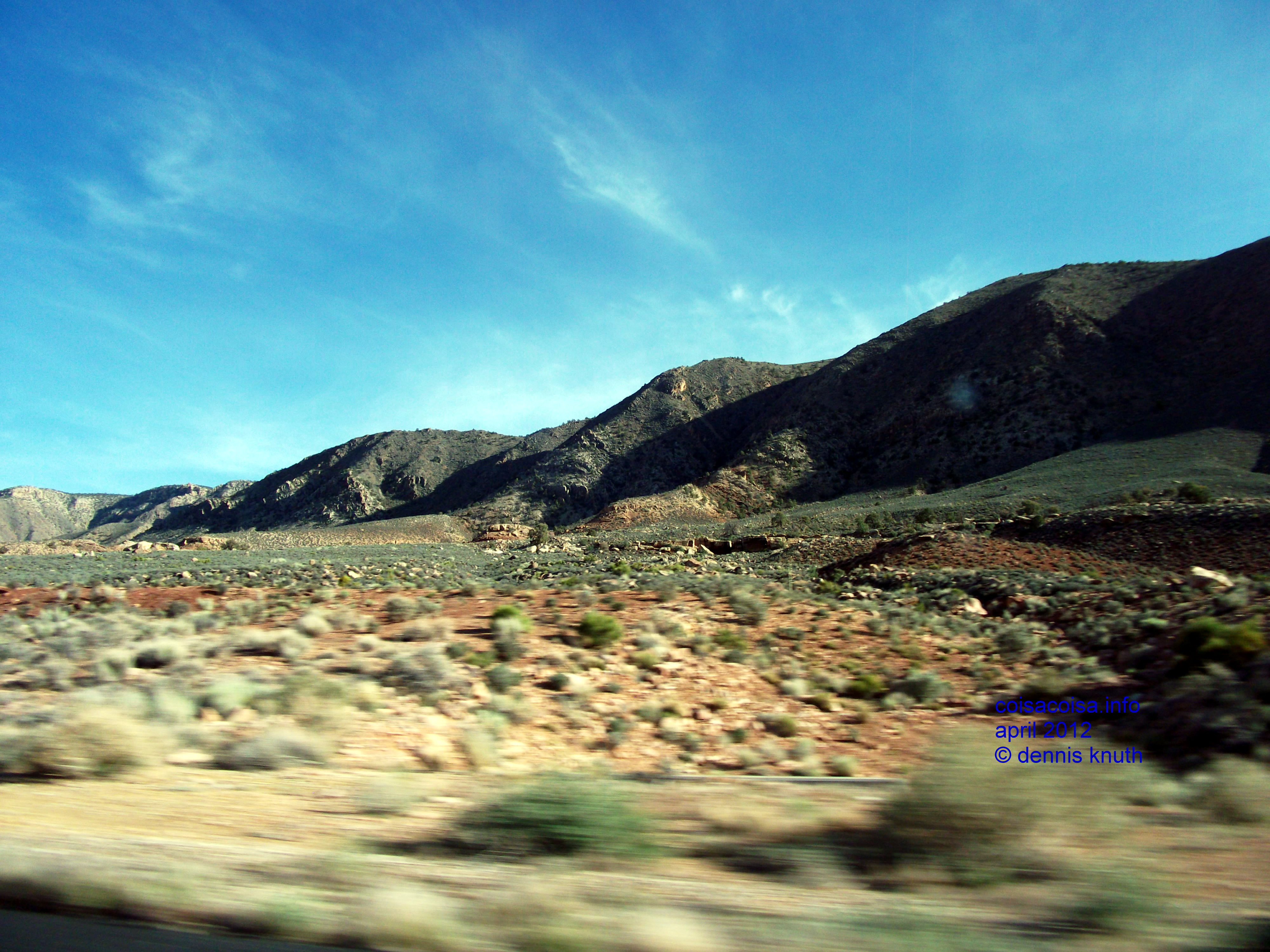 Painted desert hills transitioning to rubble