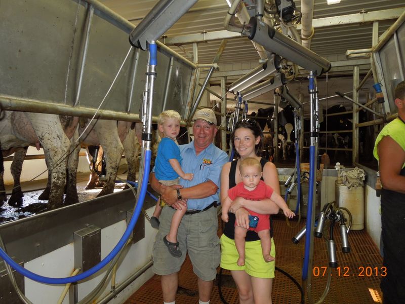 Colin Gary Julia Gavin inspect the milking parlor