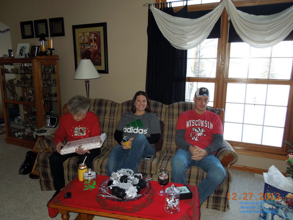 Kelly and Nate watch Emogene open a gift