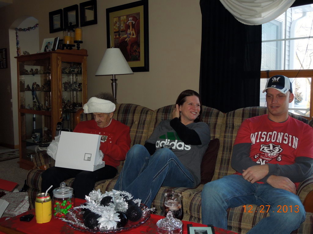 Emogene opens a gift Kelly and Nathan are amused