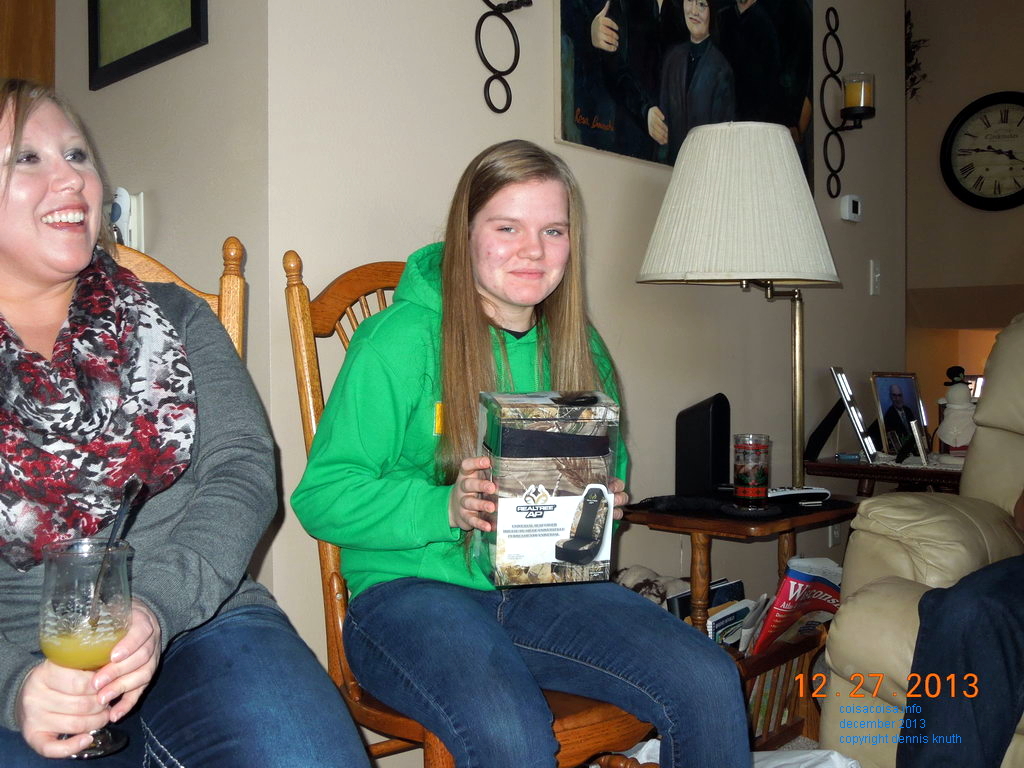 Grandma Sherri gives car seat covers to Kelsey for Christmas