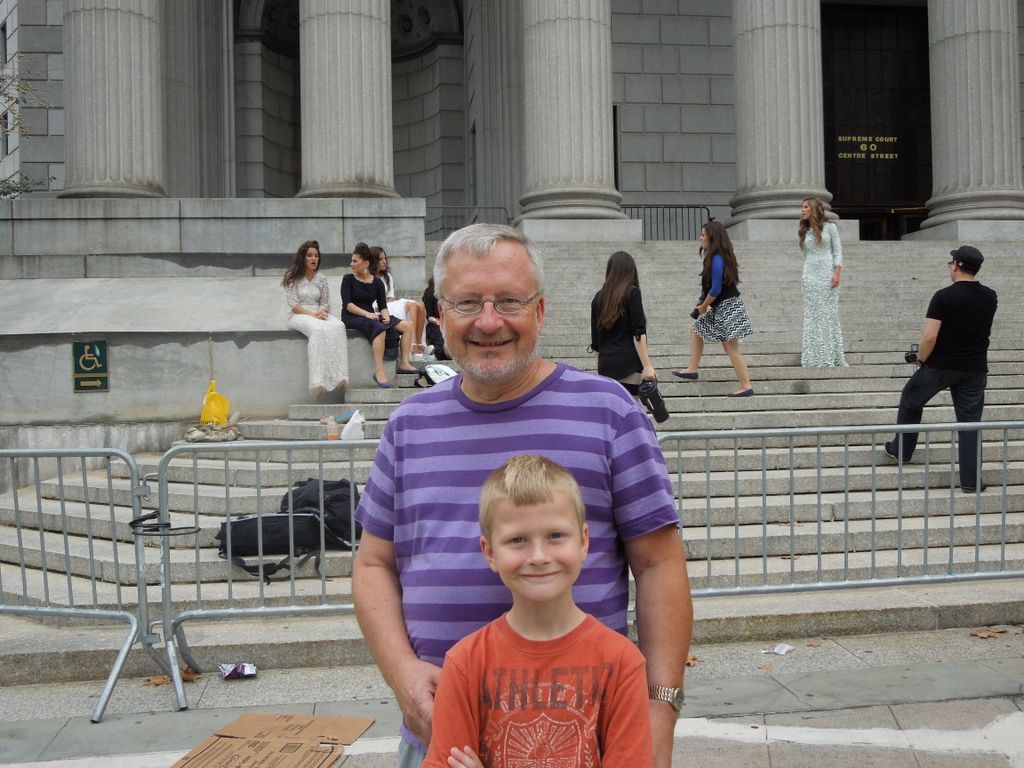 Dennis Knuth and Jared watch a fashion shoot downtown