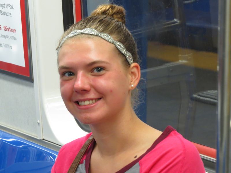 Abby Randall smiles on the train