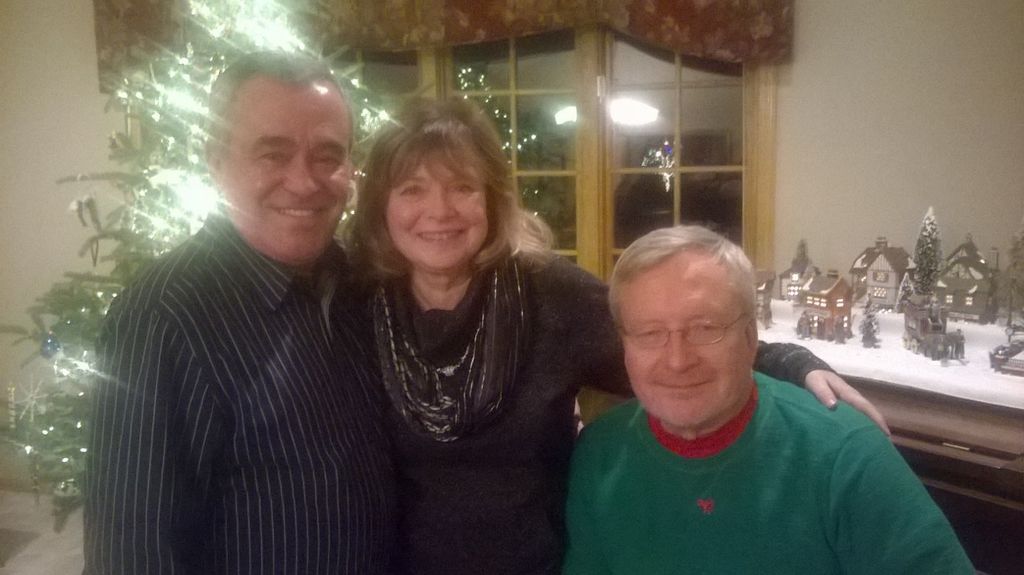 Helton Sharon and Dennis at a cocktail party