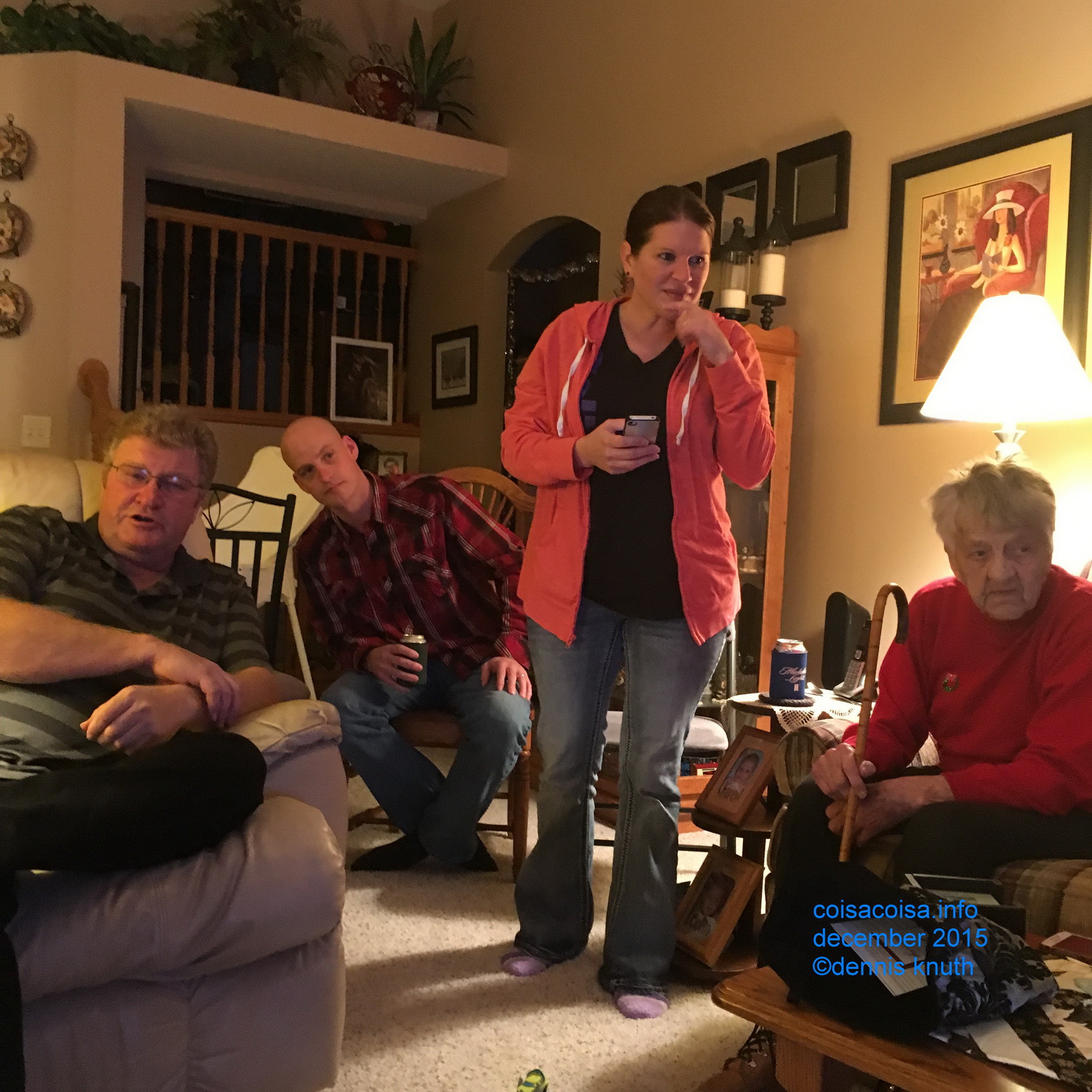 Candid photo at Christmas: Nathan, Kelly, Emogene and Karen's friend