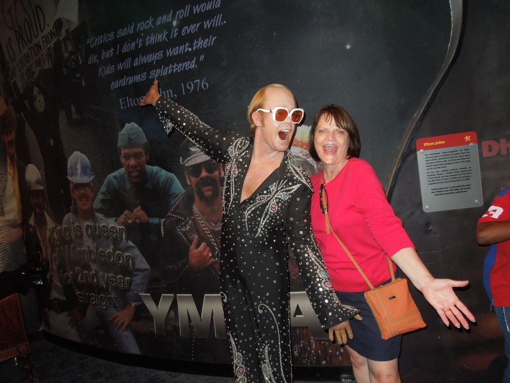 Sherri Donadean and Elton John performing