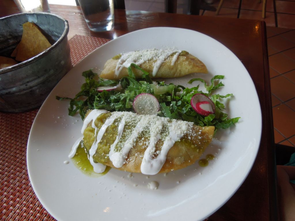 Chicken empanadas with squash blossoms