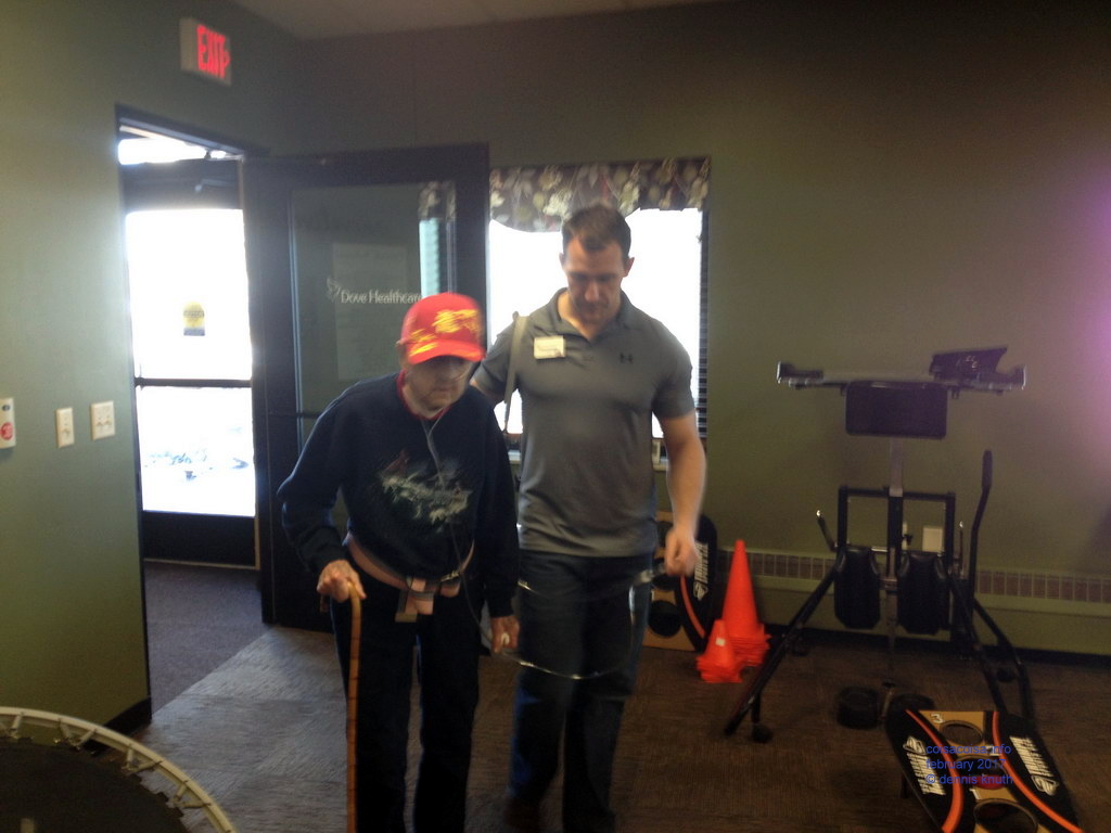 Mike returns Emogene from a walk around the hall