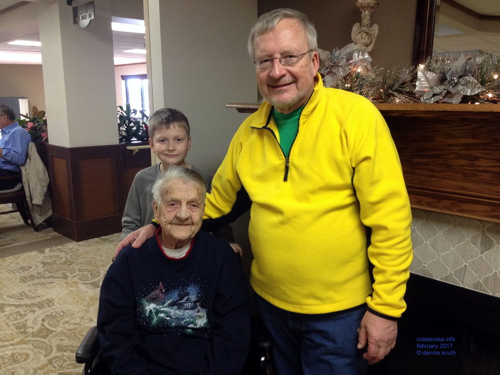 Dennis, Janed and Emogene in front of the fireplace