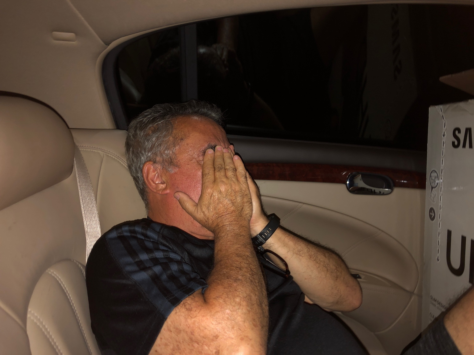 Helton and Dennis Stuffed in the Back seat with a tv